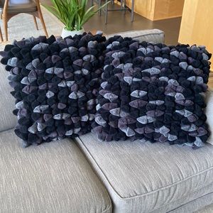Two black and gray contemporary pillow covers.